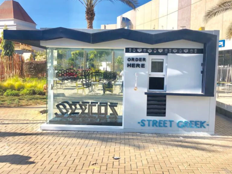 Mobile Solutions Street Greek food trailer with "ORDER HERE" sign and blue zigzag roof