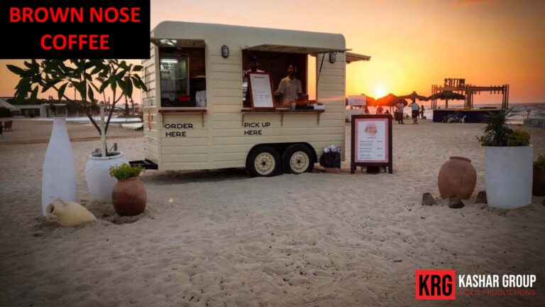 Mobile Solutions Brown Nose Coffee food trailer on a beach at sunset, with "Order Here" and "Pick Up" signs