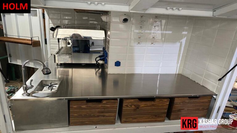 Mobile Solutions Interior of a food trailer with a professional espresso machine and wooden drawers