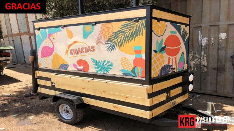 Mobile Solutions Food trailer with "GRACIAS" text and colorful food illustrations