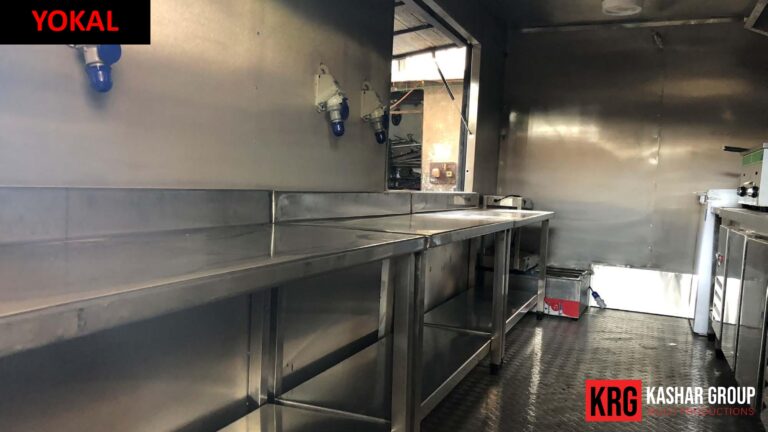Mobile Solutions Interior of a stainless steel food trailer kitchen with workbenches