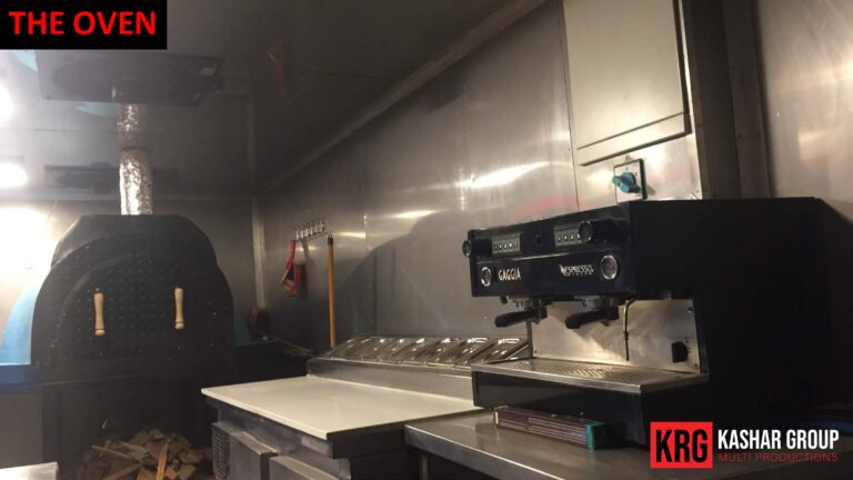 Mobile Solutions Inside a food trailer: Gaggia espresso machine next to a wood-fired oven