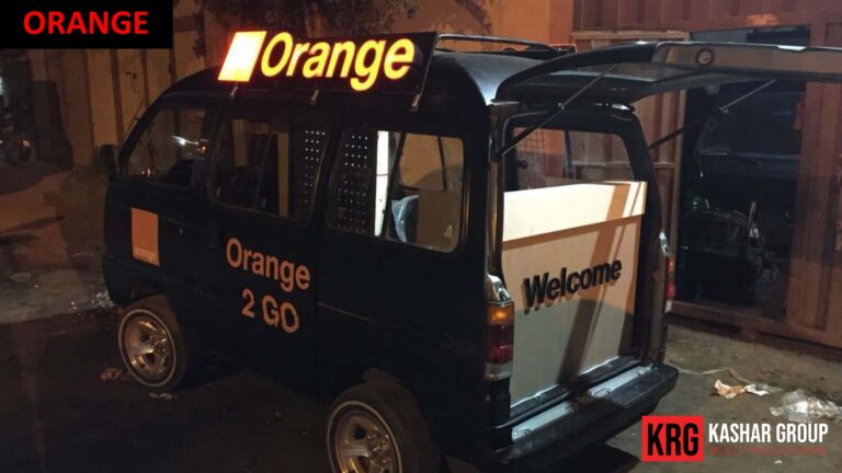 Mobile Solutions Orange branded mobile van with "Orange 2 GO" and "Welcome" text