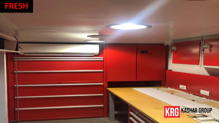 Mobile Solutions Interior of a red advertising trailer with tool chests and workbench