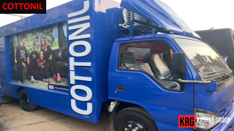 Mobile Solutions Blue advertising trailer with "COTTONIL" branding and images of children