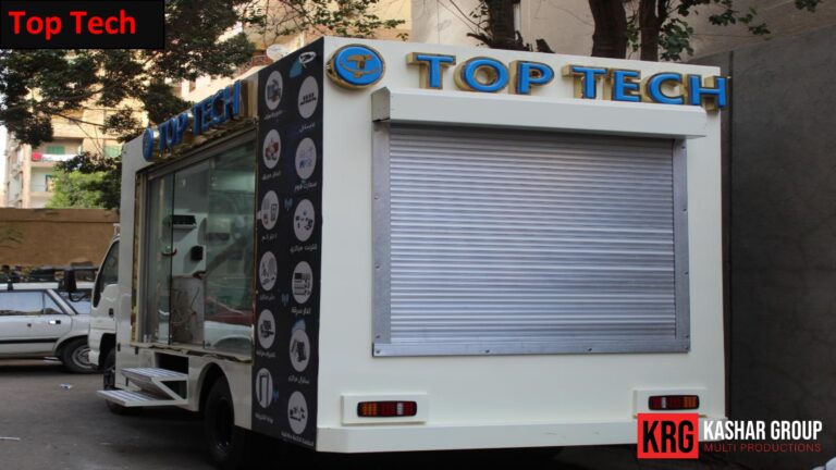 Mobile Solutions Top Tech advertising trailer with a roll-up door and graphics