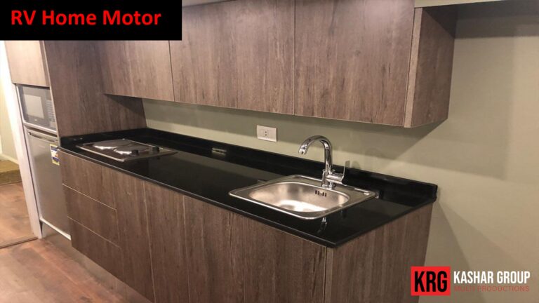 Mobile Solutions RV home motor kitchen with sink, stovetop, and cabinets